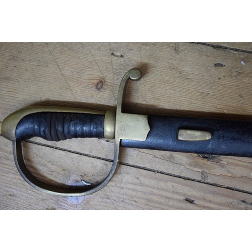 1974 - A 19th century cavalry sabre and steel scabbard.