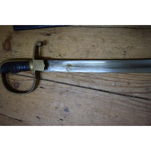 1974 - A 19th century cavalry sabre and steel scabbard.