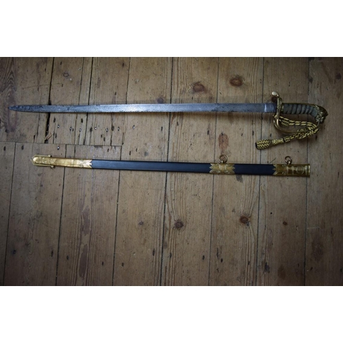 1975 - A Victorian naval officer's dress sword and scabbard, the scabbard bearing plaque 'Whiteman, Outfitt... 