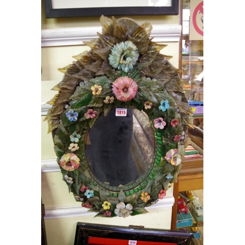 1815 - A 19th century Venetian coloured glass wall mirror, applied with leaves and flowers, 61 x 41cm.