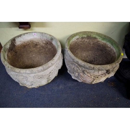 1821 - A pair of composition stone circular planters., moulded in relief with classical masks, 56cm diamete... 