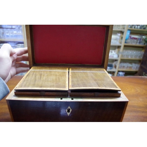 1827 - A George III mahogany and tulip wood crossbanded tea caddy, 23cm wide.