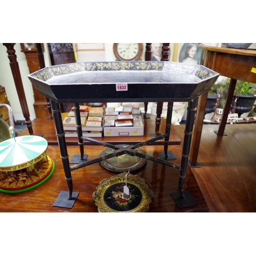 1832 - An antique papier-mache tray on simulated bamboo stand, 65.5cm wide.