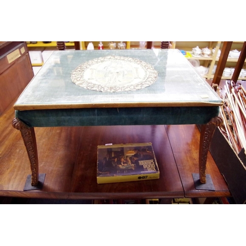 1838 - A carved walnut and upholstered table, 73cm wide.