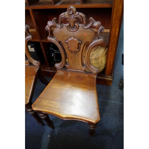 1841 - A late Regency mahogany hall chair; together with another pair of Victorian mahogany hall chairs.