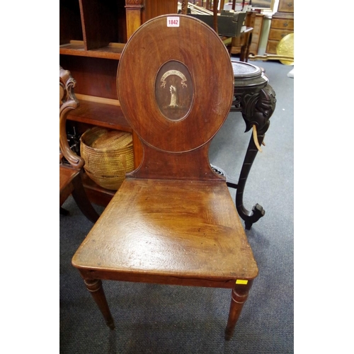 1842 - A George III mahogany hall chair, the oval back painted with a crest and motto 'Firmor AD Fidem'.