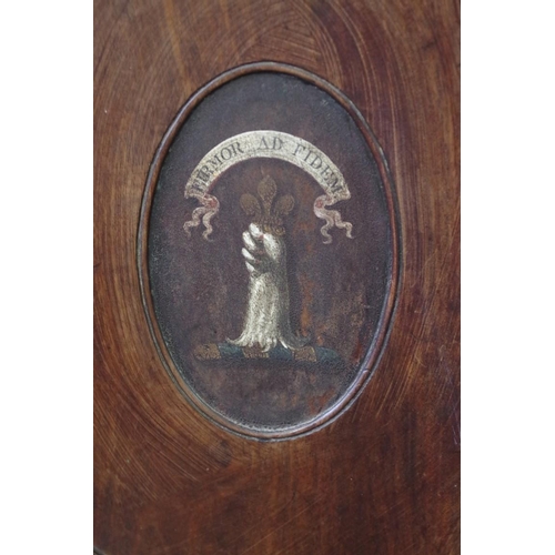 1842 - A George III mahogany hall chair, the oval back painted with a crest and motto 'Firmor AD Fidem'.