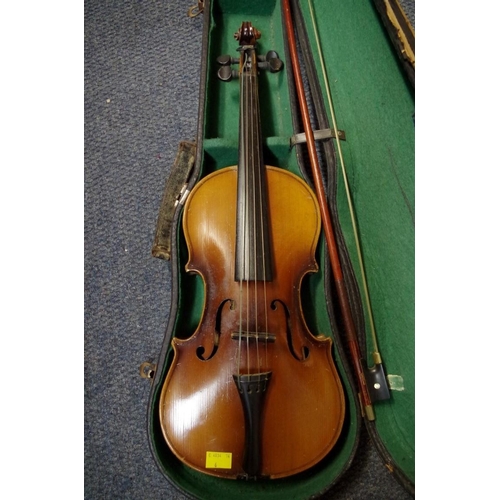 1850 - An old violin, with 14 in back, cased and with two bows; together with another small violin, case an... 