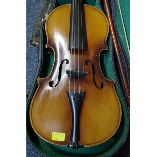 1850 - An old violin, with 14 in back, cased and with two bows; together with another small violin, case an... 