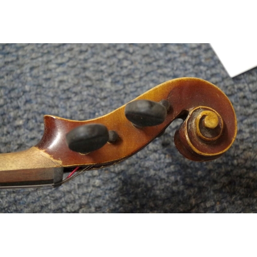 1850 - An old violin, with 14 in back, cased and with two bows; together with another small violin, case an... 