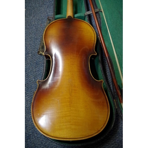 1850 - An old violin, with 14 in back, cased and with two bows; together with another small violin, case an... 