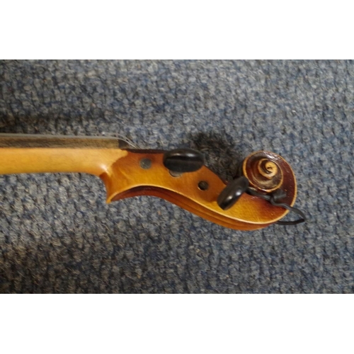 1850 - An old violin, with 14 in back, cased and with two bows; together with another small violin, case an... 