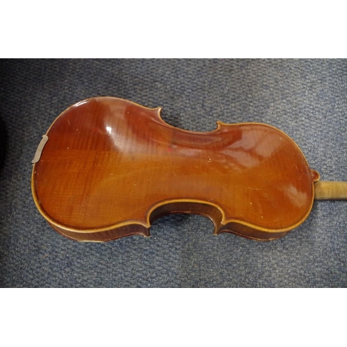 1851 - An antique Continental violin, with 14 in back, cased and with bow.