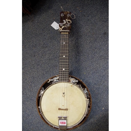 1858 - An F D H Ltd four string banjolele, cased.