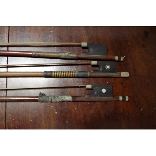 1860 - Three antique violin bows, each indistinctly inscribed with name.