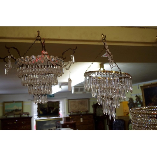 1870 - A set of three four tier chandeliers.