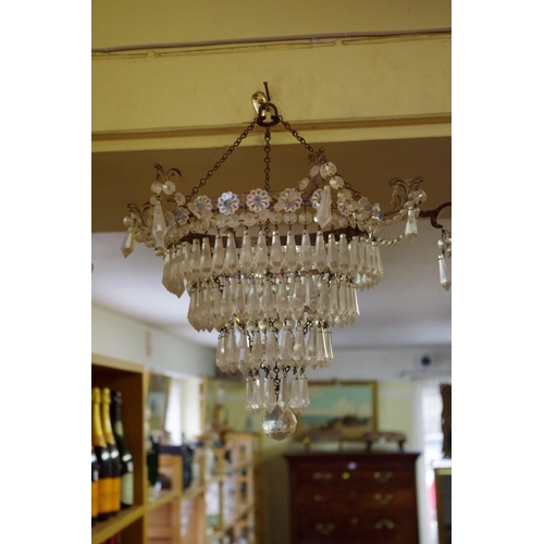 1870 - A set of three four tier chandeliers.