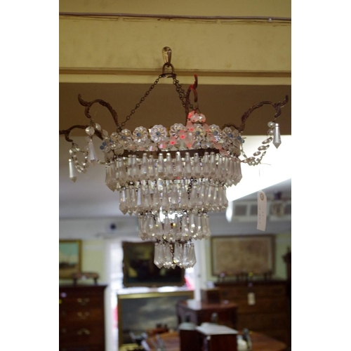 1870 - A set of three four tier chandeliers.