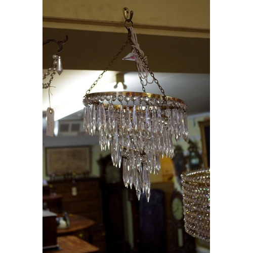 1870 - A set of three four tier chandeliers.