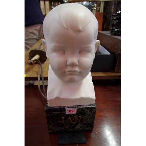 1893 - Ernest Roland Bevan, a white marble bust of a young boy's head, initialled, on green marble base, to... 