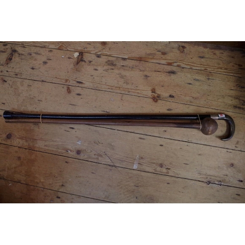 1894 - A horn handled, silver and mounted and ebonized walking stick; together with another knobkerrie styl... 