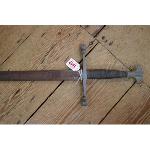 1912 - An old practice sword and leather scabbard; together with another old sword.