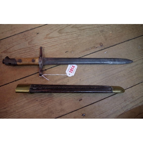 1914 - An antique bayonet and scabbard.