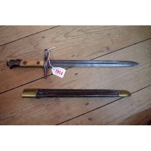 1914 - An antique bayonet and scabbard.