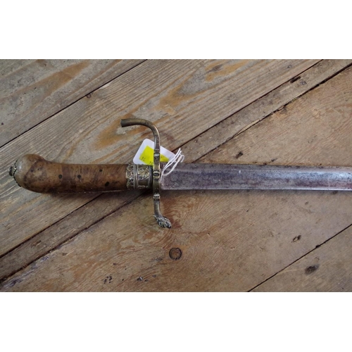 1915 - An 18th/19th century sabre sword, the burr wood pistol grip handle with brass mounts, total length 7... 