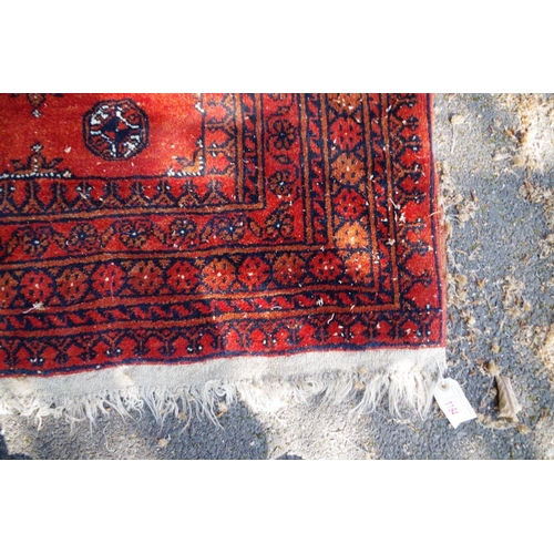 1194 - A Bokhara rug, having floral and geometric design; together with another Bokhara rug having three ce... 