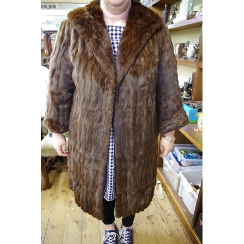 1746 - A vintage brown fur three quarter length coat; together with a brown fur cape.