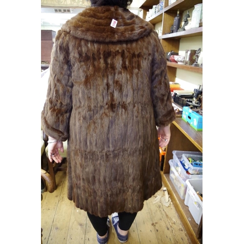 1746 - A vintage brown fur three quarter length coat; together with a brown fur cape.