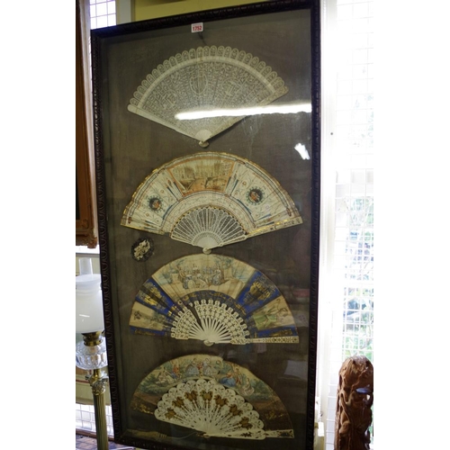 1752 - A framed display of four 19th century fans, to include a Chinese ivory brise example, the guards 27c... 