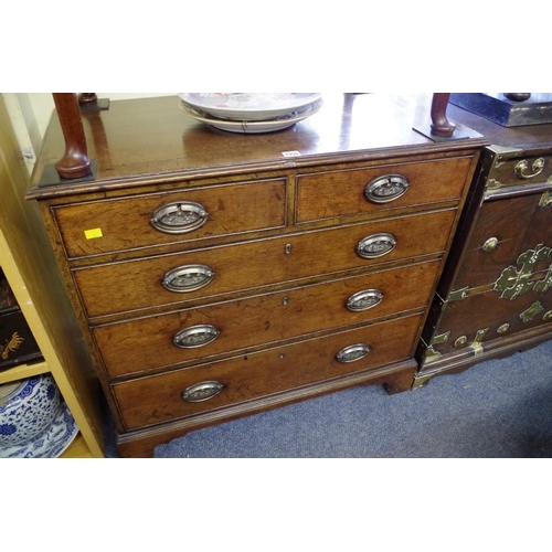 1759 - An interesting and unusual George III oak and walnut chest of drawers, possibly Scottish, the origin... 