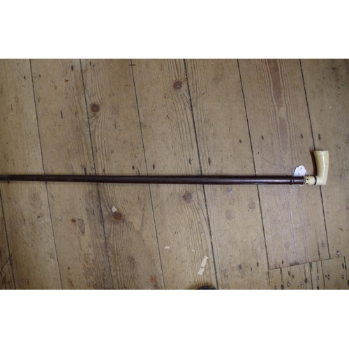 1833 - An antique ivory handled hardwood walking stick, with bone inlay to the handle.