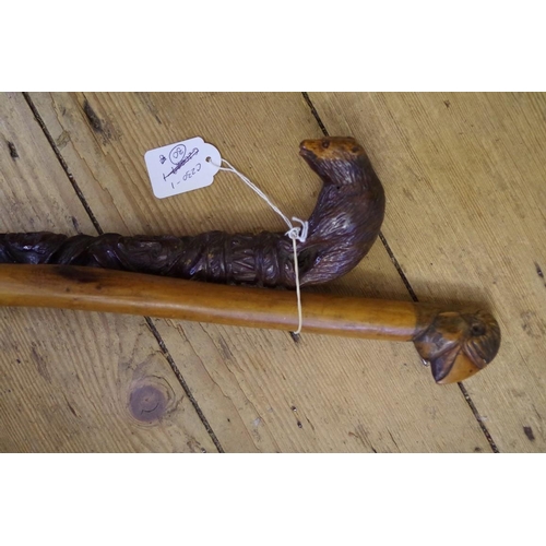 1841 - A novelty carved wood walking cane, inscribed 'W. Halliday'; together with another novelty carved wo... 