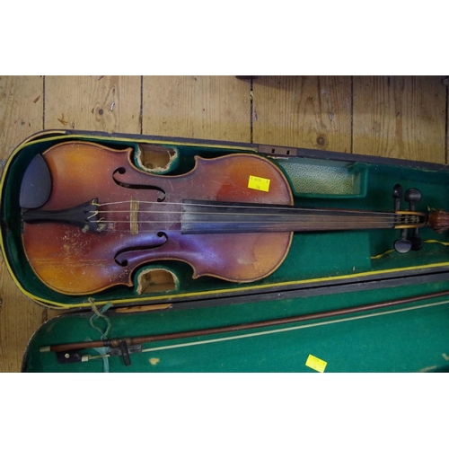 1852 - Two Continental violins, comprising one 13in and one 14in, each with bow and ebonized wood case... 