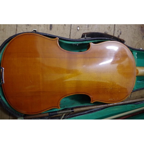 1854 - A violin, with 14in back, with two bows and case. 