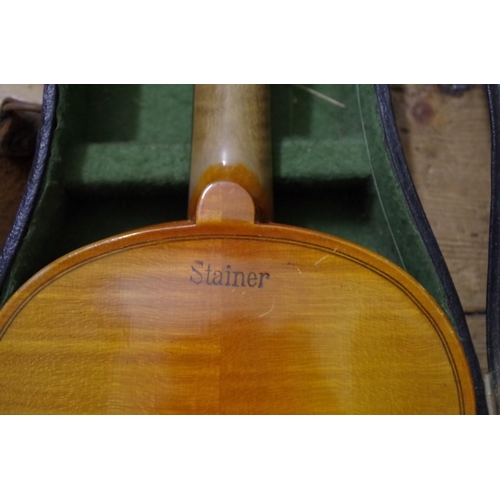 1856 - A Continental violin, with 14in back inscribed 'Stainer', with bow and case.