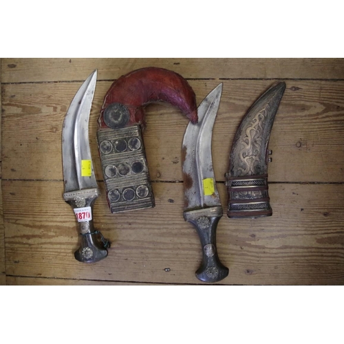 1870 - An eastern horn handled jambiya and metal mounted leather sheath; together with another similar east... 