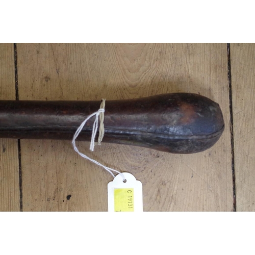 1883 - An old leather club or cosh, 60cm.