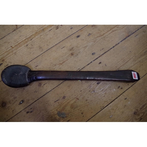 1890 - Ethnographica: a tribal wood ladle, 52cm long. 