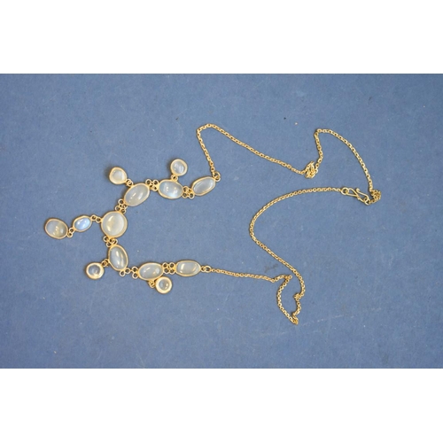 100 - An Edwardian moonstone necklace, on an unmarked fine gold chain.