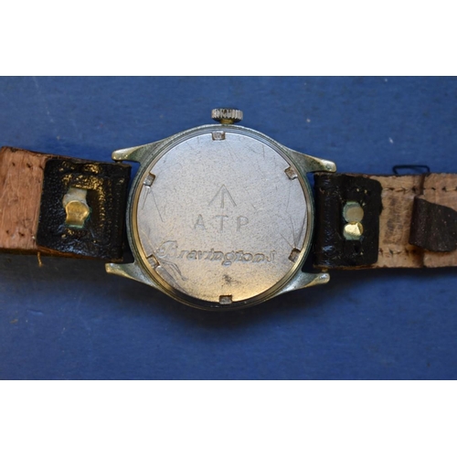 68 - A World War ll era ATP military wristwatch, by Bravington, on leather strap.