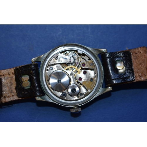 68 - A World War ll era ATP military wristwatch, by Bravington, on leather strap.