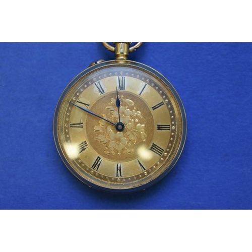 74 - An 18k gold open faced pocket watch, stem wound, having chased gold dial, 3cm.