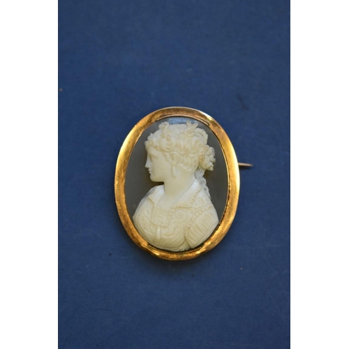 84 - A Victorian carved grey chalcedony cameo brooch, having unmarked mount, 4.5cm