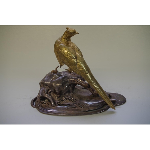 527 - An Oriental brass and electroplate model of a pheasant, signed on tablet, 22.5cm wide.... 