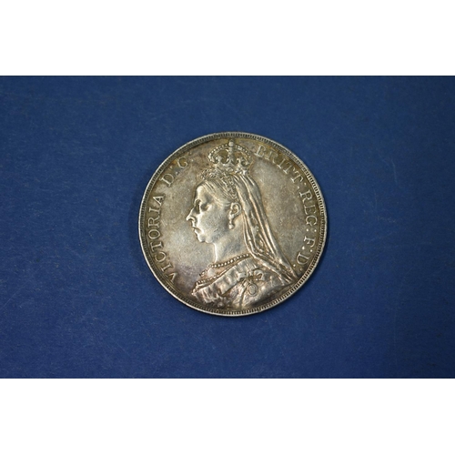 81A - A Victoria silver crown 1890; together with a silver half crown 1887 and various U.K and foreign coi... 