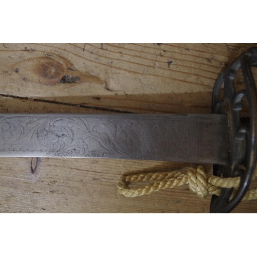 1885 - A 19th century cavalry sword and steel scabbard.